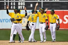 The A's go through celebratory high-fives. This happens a lot.